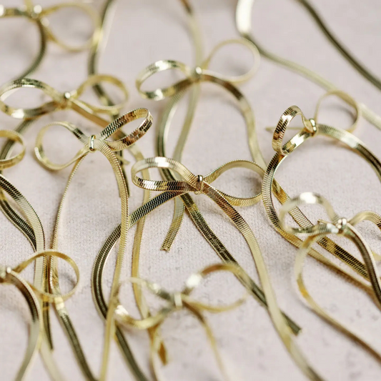 Maxi Gold Duster Bow Earrings, gold bow duster earrings, gold bow earrings, bow earrings, boutique style, boutique accessory, st. armands designs of sarasota